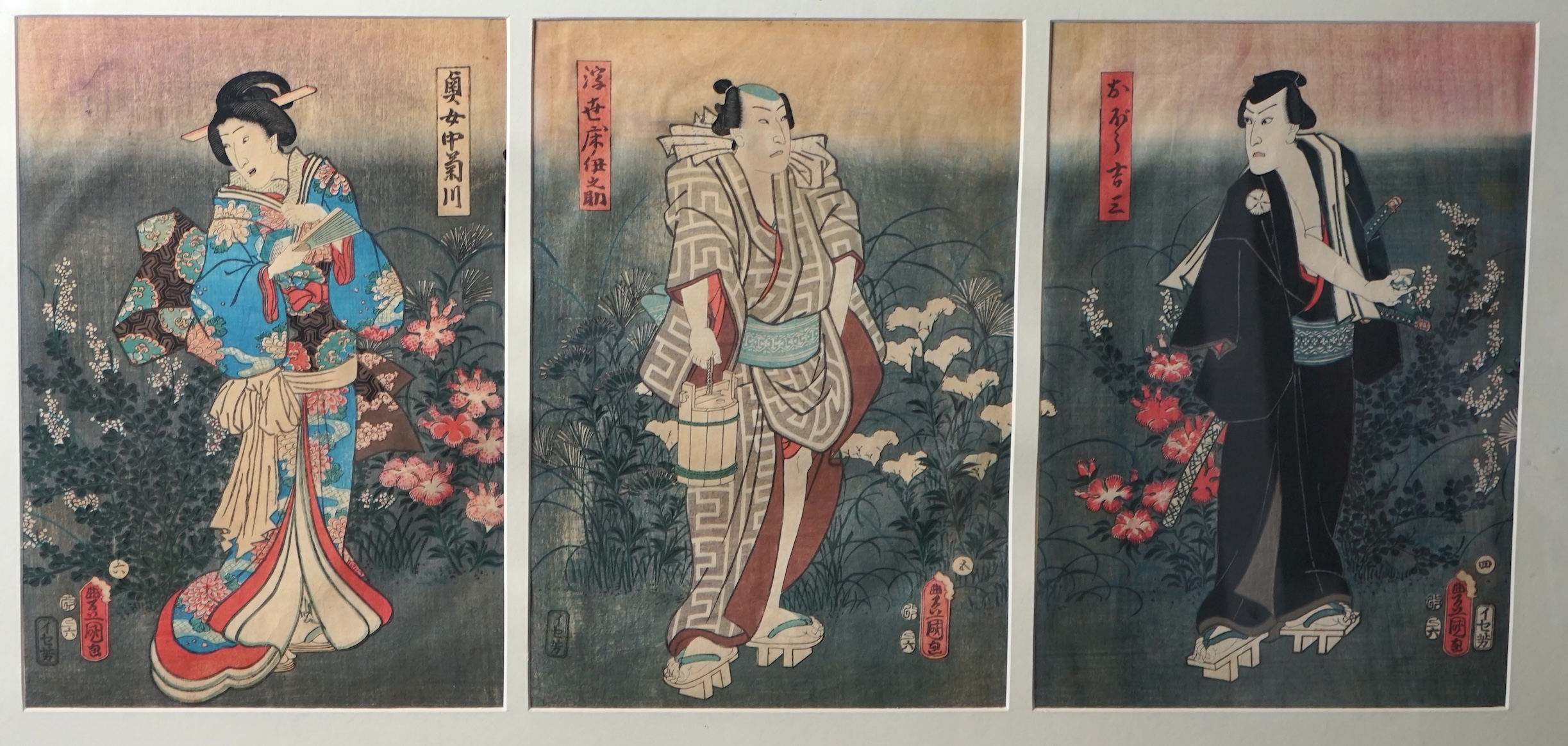 Kunisada Toyokuni III (1786-1864), woodblock tryptych, Three actors standing in gardens, each 35 x 24cm. Condition - possibly some paper discolouration but not laid down, margins covered by the mount